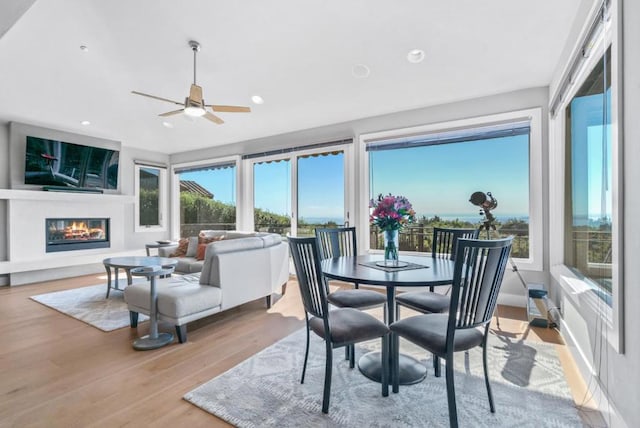 sunroom / solarium with ceiling fan