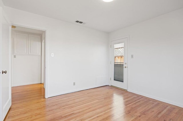 unfurnished room featuring light wood-type flooring