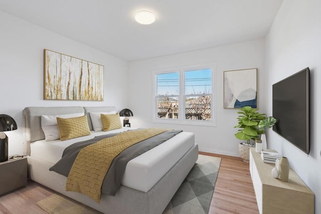 bedroom with light hardwood / wood-style flooring