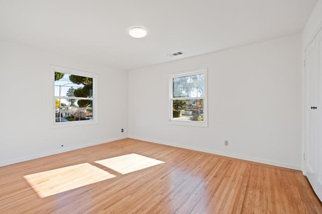 spare room with light wood-type flooring