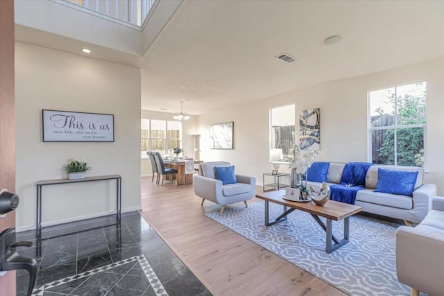 living room featuring plenty of natural light and dark hardwood / wood-style floors