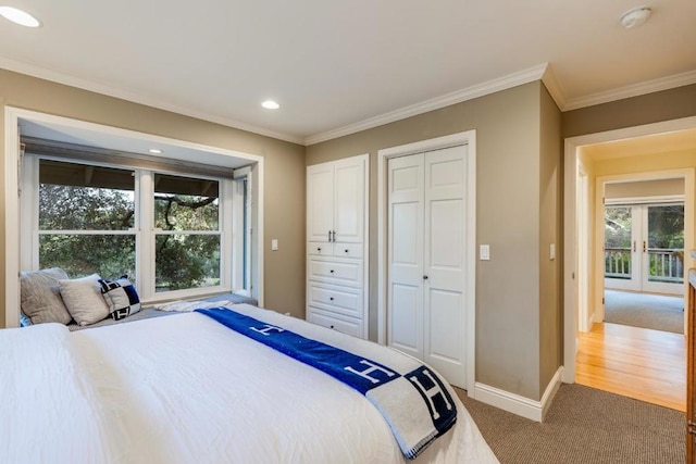 bedroom with ornamental molding and carpet flooring