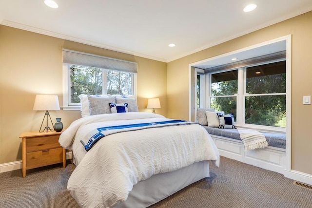 carpeted bedroom featuring crown molding