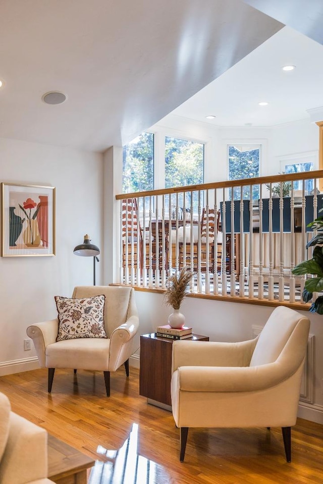 living area with hardwood / wood-style flooring