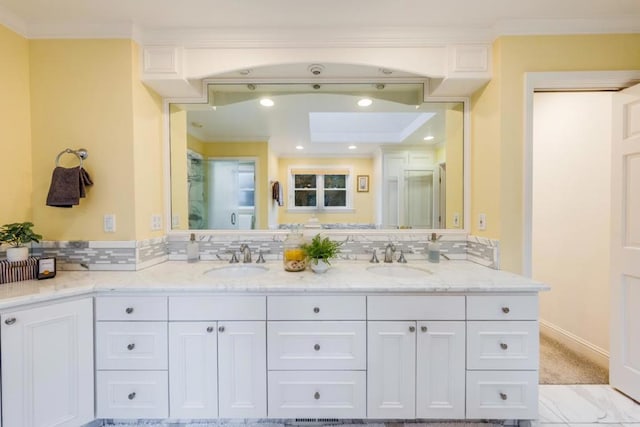 bathroom featuring ornamental molding, an enclosed shower, vanity, and backsplash