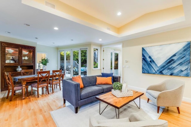 living room with french doors and light wood-type flooring