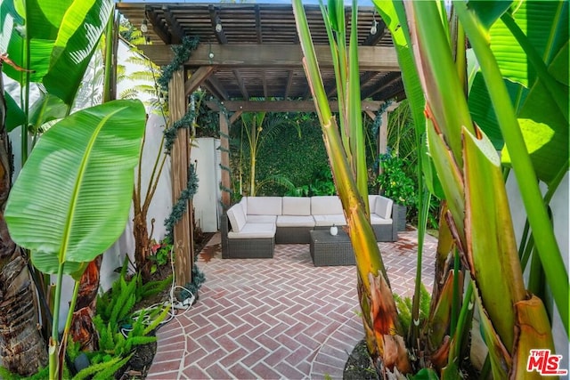 view of patio featuring a pergola and an outdoor hangout area