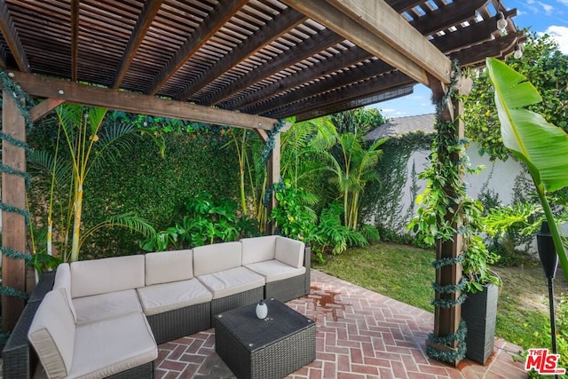 view of patio / terrace with an outdoor hangout area and a pergola