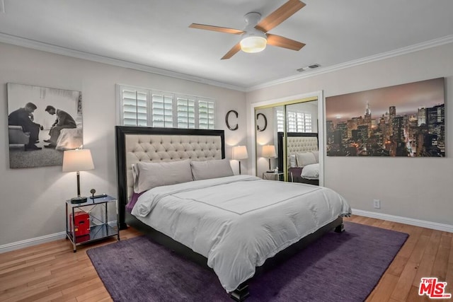 bedroom featuring crown molding, ceiling fan, a closet, and light hardwood / wood-style flooring