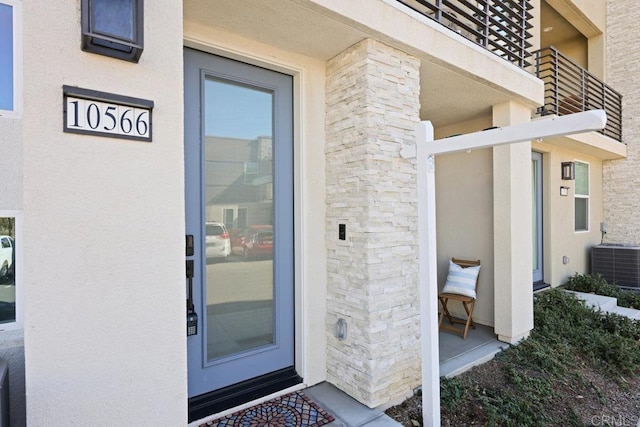 doorway to property with central AC