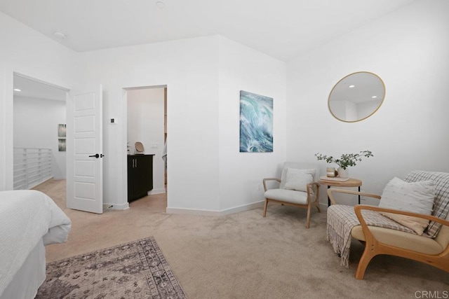 living area featuring light colored carpet