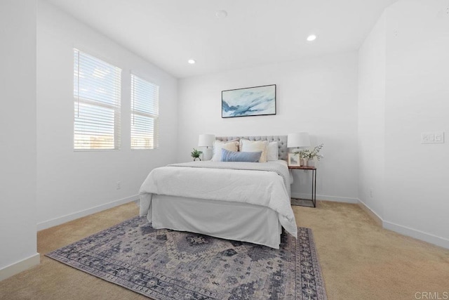 bedroom featuring light colored carpet