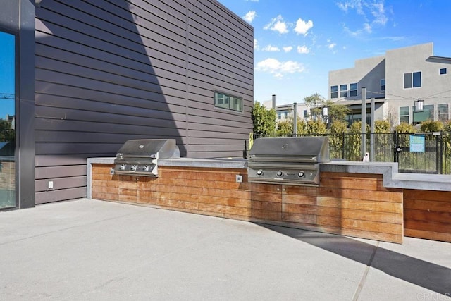 view of patio featuring grilling area and exterior kitchen