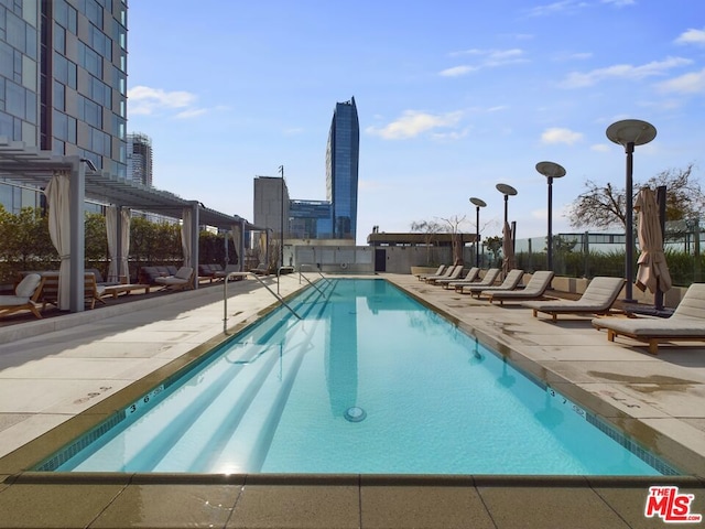 view of swimming pool featuring a patio