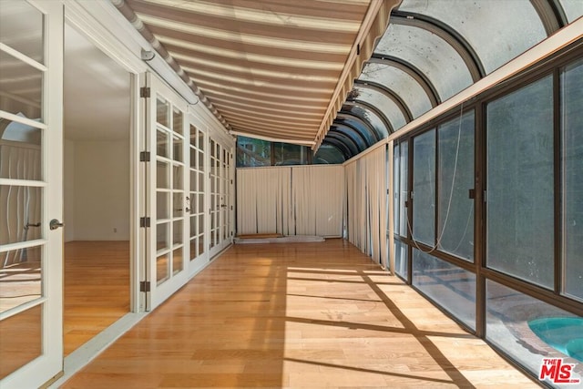 interior space with french doors and vaulted ceiling