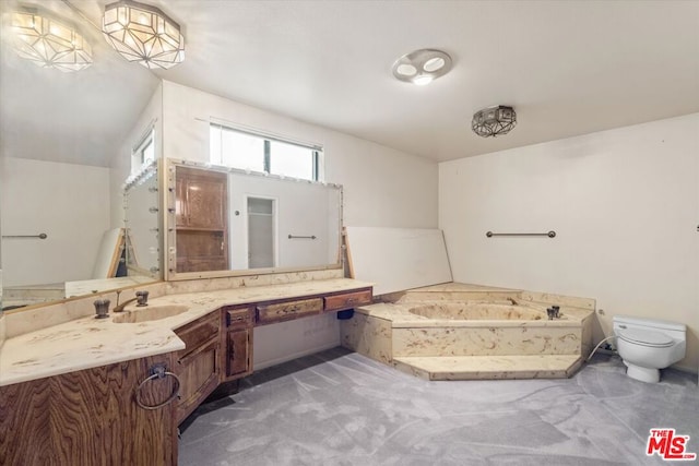 bathroom with vanity, a bathtub, and toilet