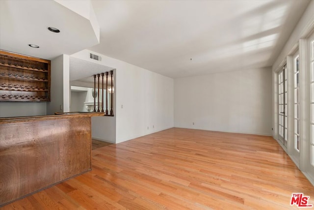 unfurnished living room with light wood-type flooring