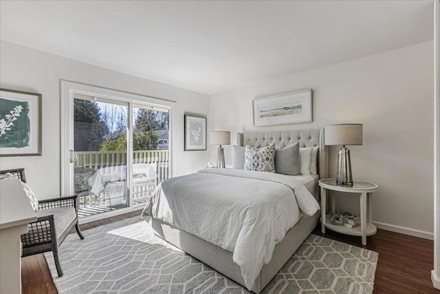 bedroom with dark hardwood / wood-style floors and access to exterior