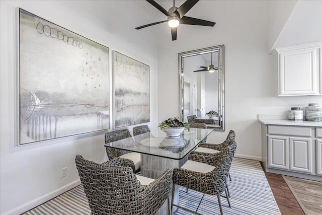 dining space with ceiling fan and light hardwood / wood-style floors