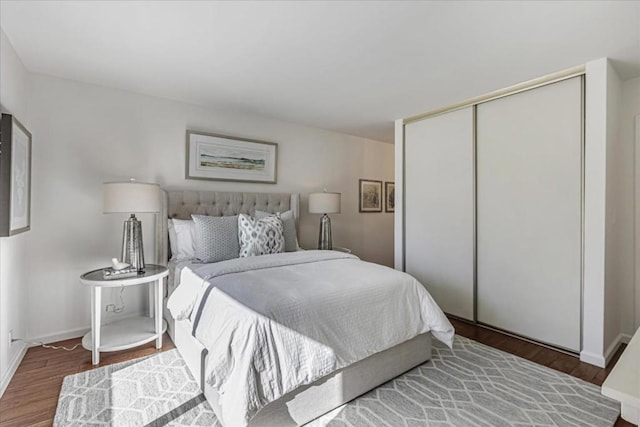 bedroom featuring hardwood / wood-style flooring and a closet