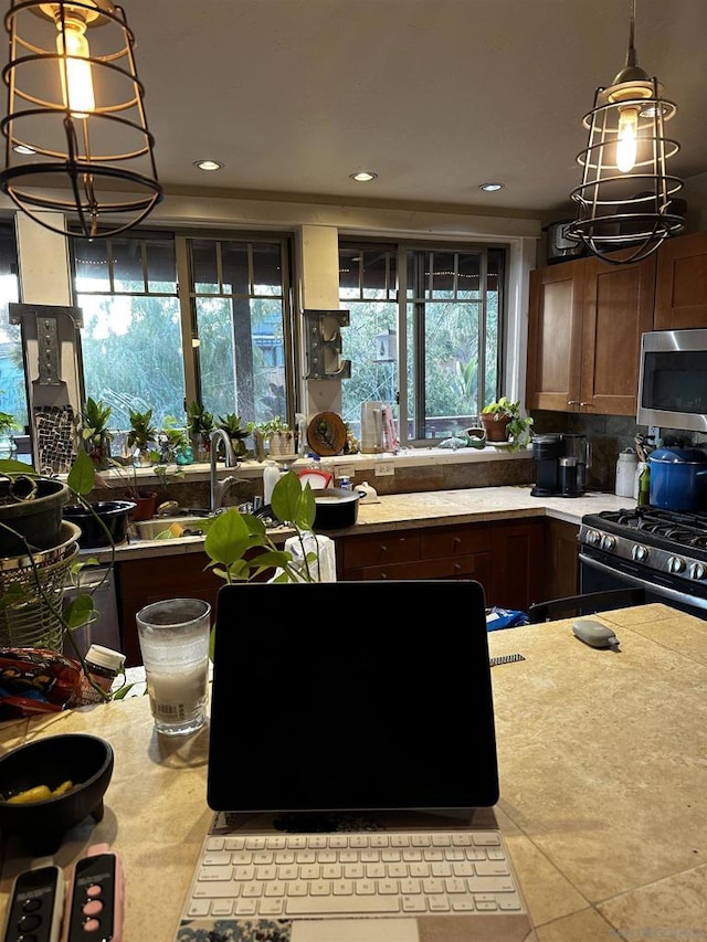 kitchen featuring a wealth of natural light and appliances with stainless steel finishes