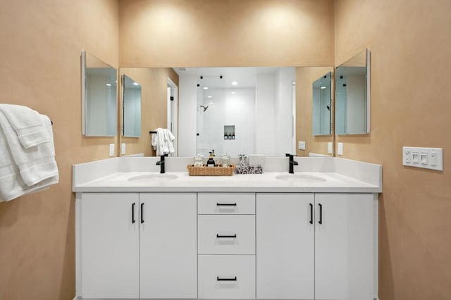 bathroom with vanity and a shower