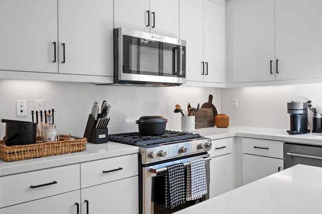 kitchen with stainless steel appliances and white cabinets