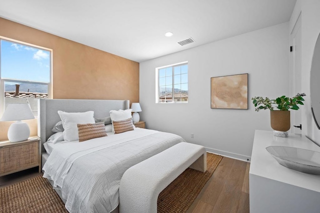 bedroom featuring dark wood-type flooring