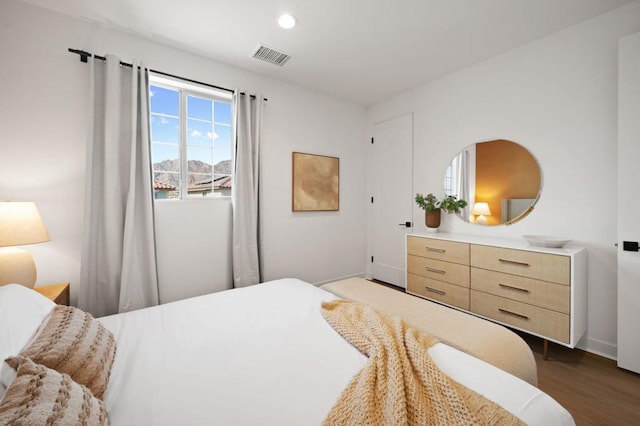 bedroom featuring dark hardwood / wood-style flooring