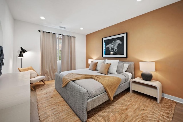 bedroom with hardwood / wood-style floors