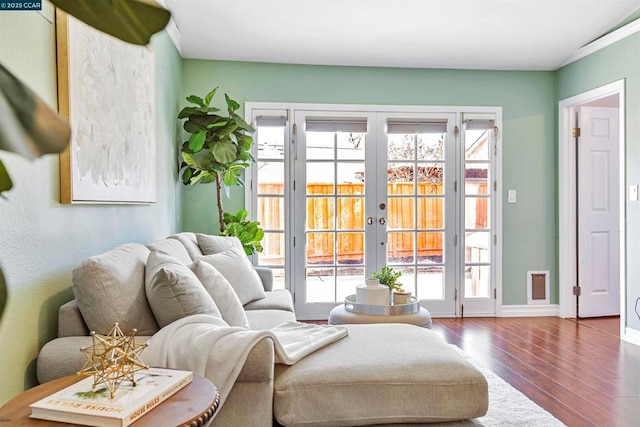 sitting room featuring hardwood / wood-style flooring and french doors