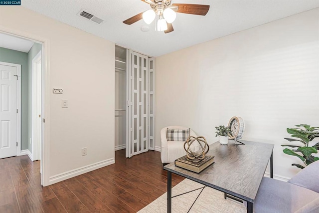 office featuring dark wood-type flooring and ceiling fan