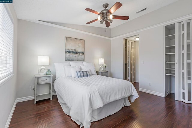 bedroom with ceiling fan and dark hardwood / wood-style flooring