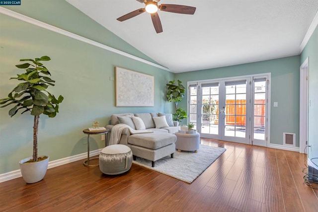 living room with wood-type flooring, french doors, ceiling fan, and vaulted ceiling