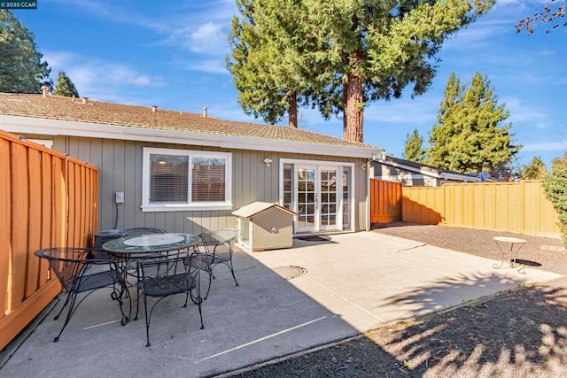 back of property with french doors and a patio area