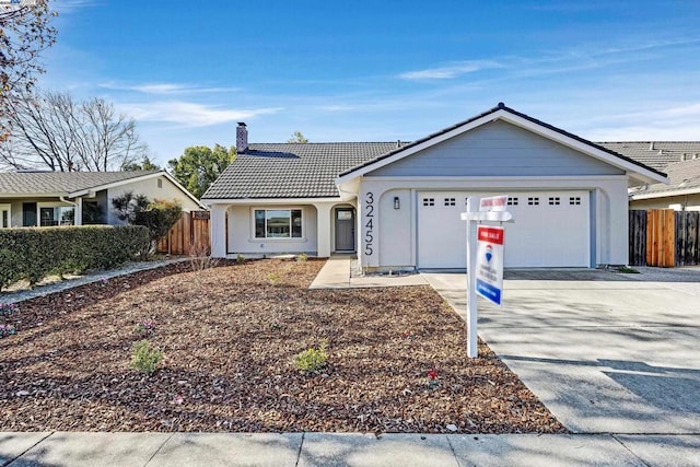 ranch-style home featuring a garage