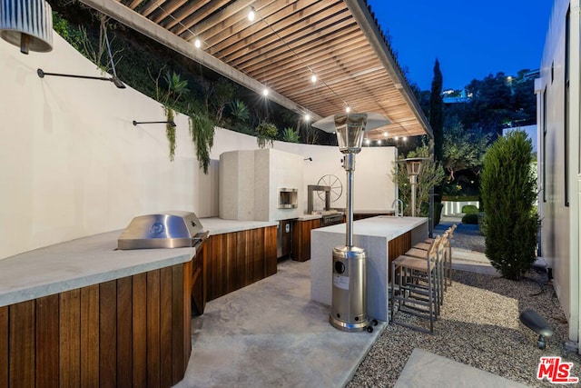 view of patio featuring exterior kitchen and exterior bar