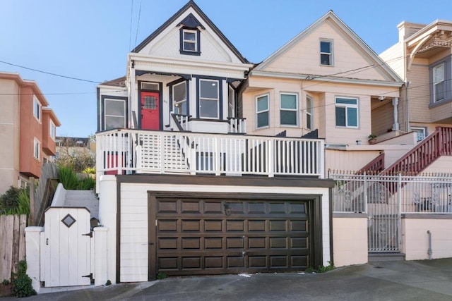 view of front facade with a balcony and a garage