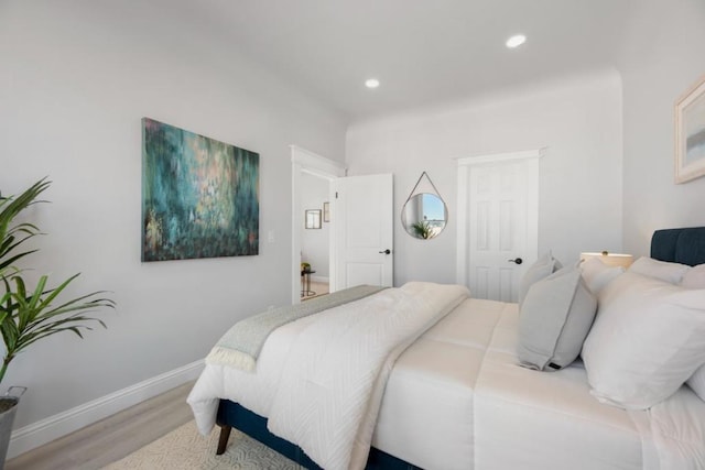 bedroom with wood-type flooring