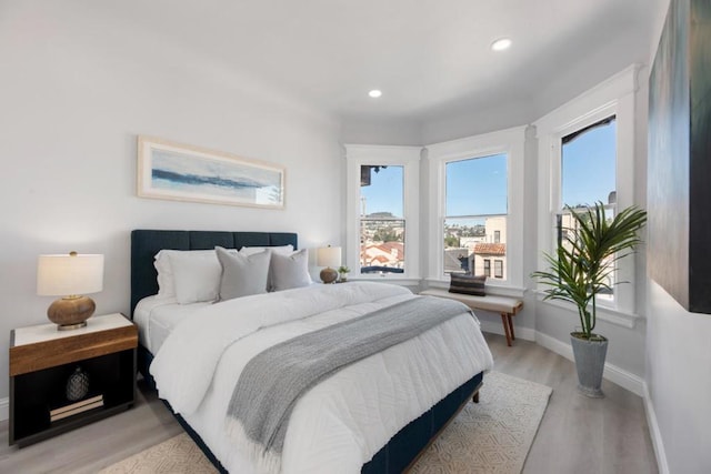 bedroom with light wood-type flooring