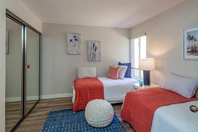 bedroom with hardwood / wood-style flooring and a closet