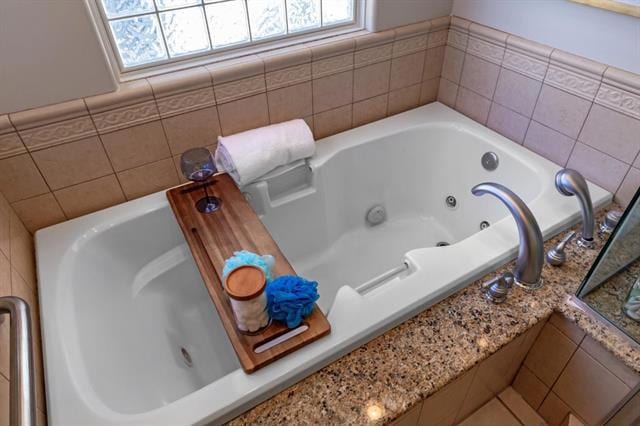 bathroom featuring a relaxing tiled tub