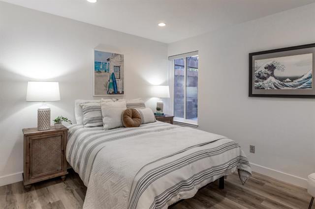 bedroom with wood-type flooring