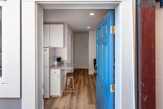 hall featuring light hardwood / wood-style floors