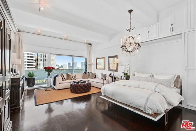 bedroom with an inviting chandelier and dark wood-type flooring