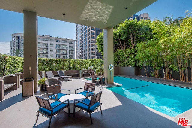 view of pool featuring a patio area