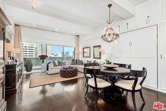 dining room featuring an inviting chandelier and dark hardwood / wood-style flooring