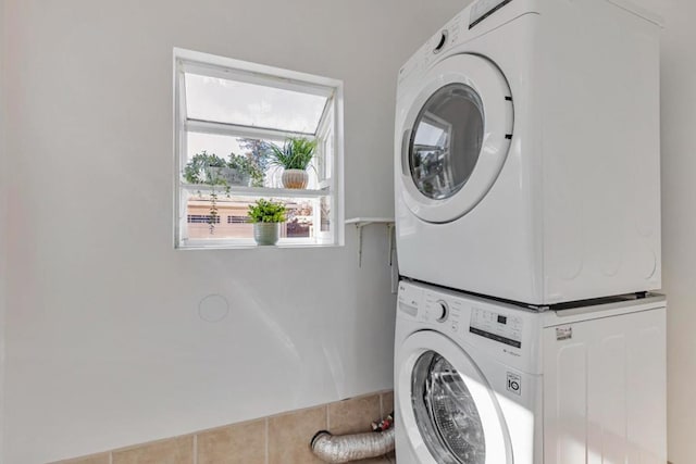 laundry area with stacked washer / dryer