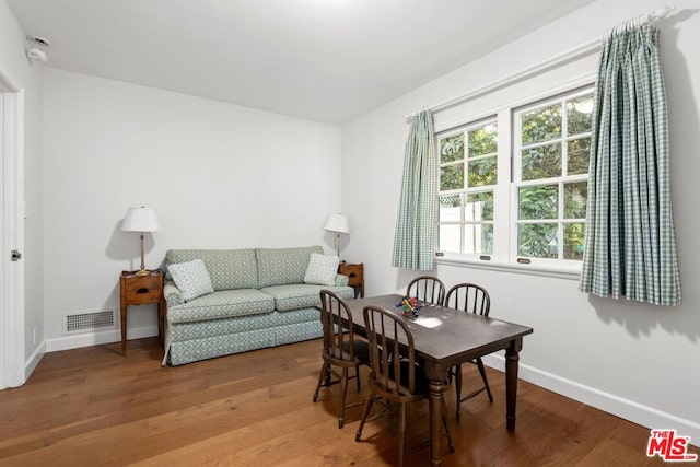 dining area with wood-type flooring