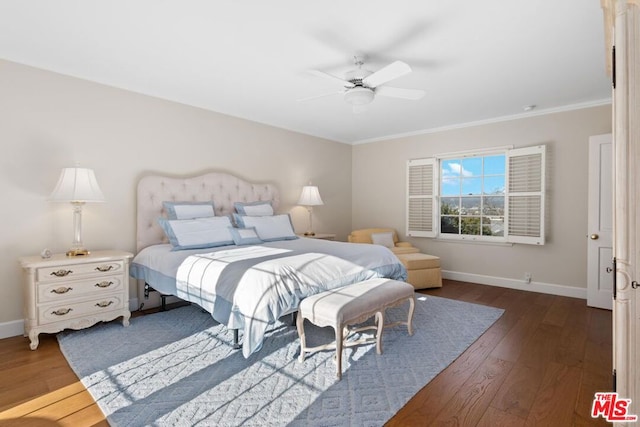 bedroom featuring ceiling fan, ornamental molding, and dark hardwood / wood-style flooring